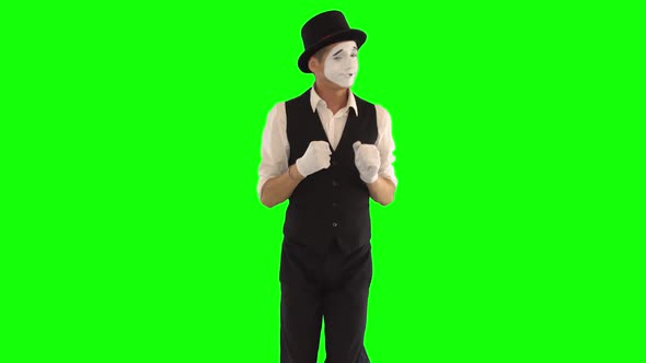 Funny Male Mime in White and Black Clothes Imitating Dancing