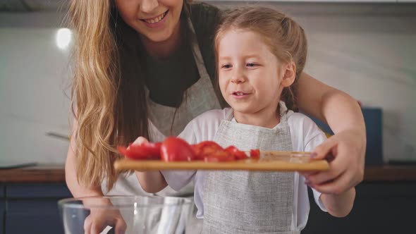 Mother Hugs Beautiful Daughter From Behind