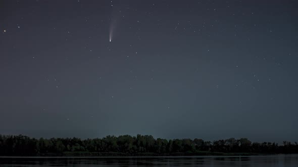 The Comet Moves Across the Night Sky Among the Stars