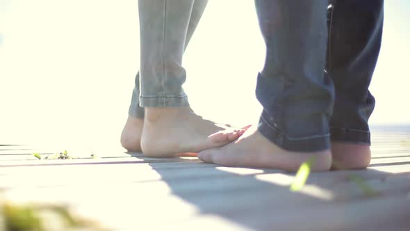 Lovers playing footsies
