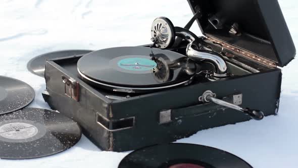 Old Gramophone Record Playing In The Snow 9