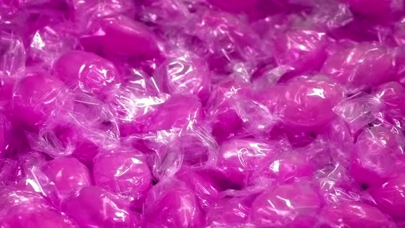 Pink Candies In Wrappers Rotating