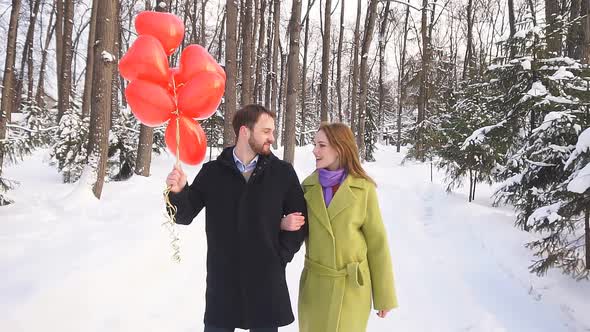 Guy and a Girl on a Date Cute Chat Walking in the Woods on a Winter Day, Love Story