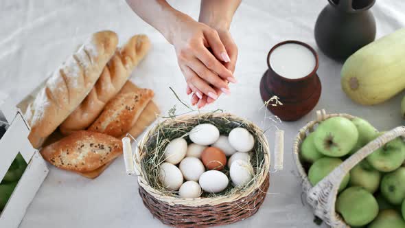 Closeup Female Hands Hold Chicken Egg Over Serving Breakfast
