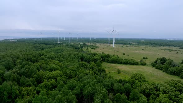 Aerial View of Powerful Wind Turbine Farm for Energy Production on Beautiful Cloudy Sky