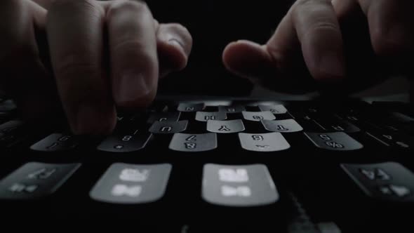 Closeup Typing on Keyboard with Man Fingers