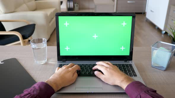 Dolly Slider Footage of Male Hands Typing on the Laptop Keyboard with Chroma Green Screen Mock Up