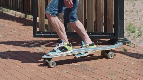 Forever Young Senior Man Going Longboarding