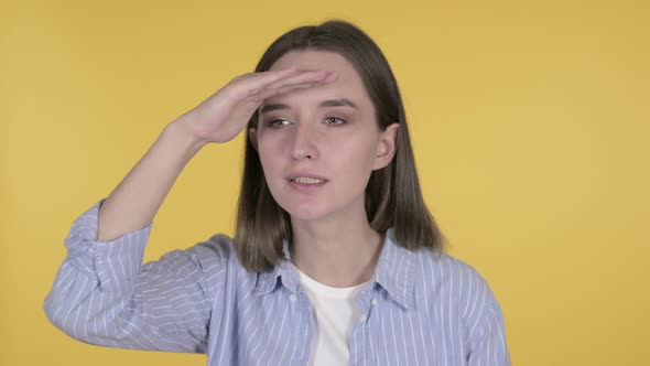 Young Woman Searching New Chance, Yellow Background