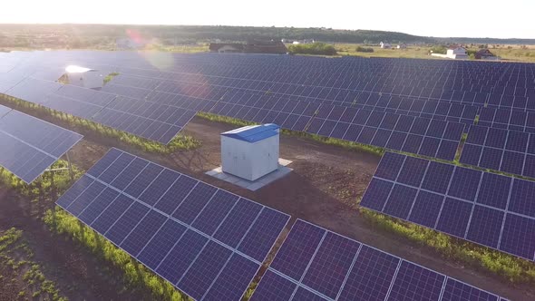 Aerial Footage of a Transformer in the Middle of a Solar Power Station