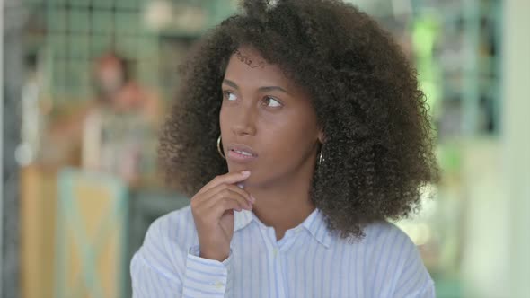 Portrait of African Businesswoman Thinking and Getting Idea