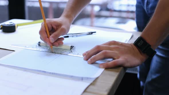 A civil engineer designs and works on drawings and analyzes the structure of a project.