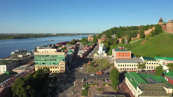 Flying Over an Russian City on the River Bank