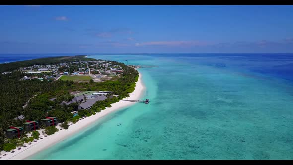 Aerial above panorama of relaxing lagoon beach vacation by turquoise water with clean sandy backgrou