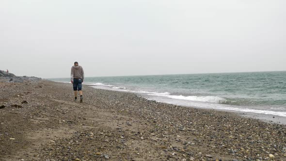 Man walking on the beach in Ireland