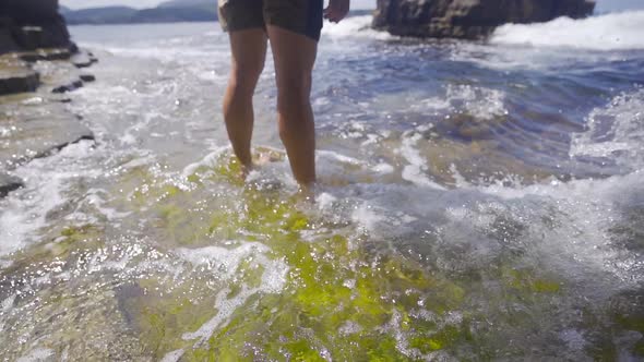 Young man at sea in slow motion.