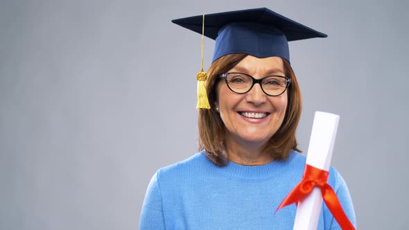 Happy Senior Graduate Student Woman with Diploma 