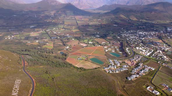 Franschhoek pass overlooking scenic town in fertile wine valley