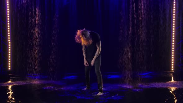 Long Haired Rock Musician Emotionally Sings Gestures and Moves Expressively to Beat of Music in Rain