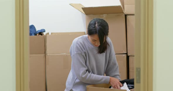 Woman find the product inside cardboard box