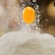 Egg Falling on a Bunch of Flour for making a Dough for Homemade Pasta - VideoHive Item for Sale
