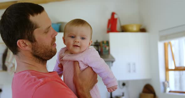 Father holding his baby 