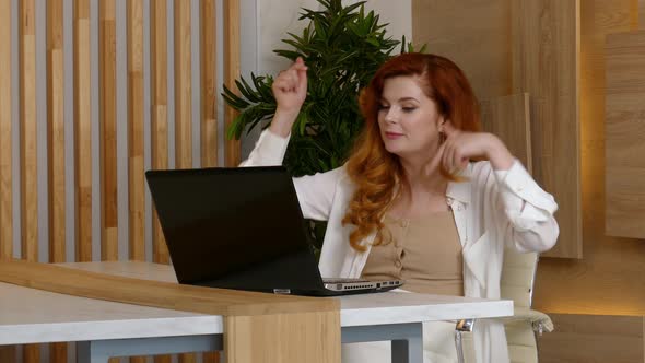 Business Woman in Office Attractive Ginger