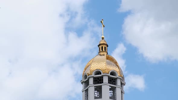 Beautiful Golden Domes of the Greek Catholic Church on a Background of Blue Sky Flying Birds