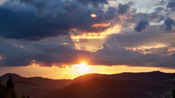 Sunset, dramatic movement of clouds over the landscape,4K