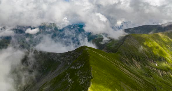 aerial hyper lapse in mountains with clouds covering camera view