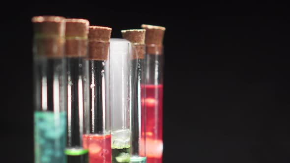 Glass Test Tubes with Boiling Multicolored Liquid