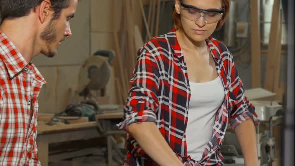 Professional Cabinetmakers Working at Their Studio