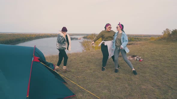 Young Women Dance Spending Time at Campsite on Green Hill