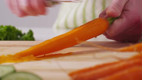 Peeling carrots, closeup