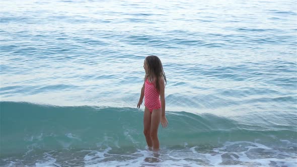 Adorable Little Girl on the Seashore Alone