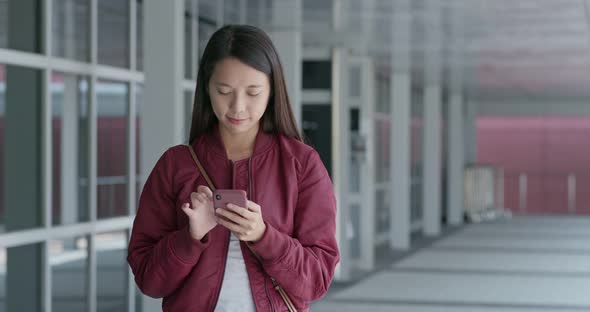 Young woman look at mobile phone