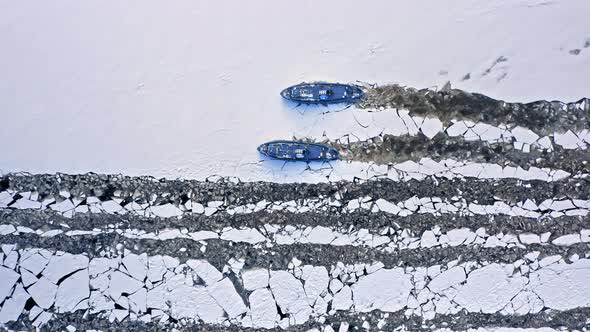 Icebreakers on river crushing ice. Aerial view of winter, Poland