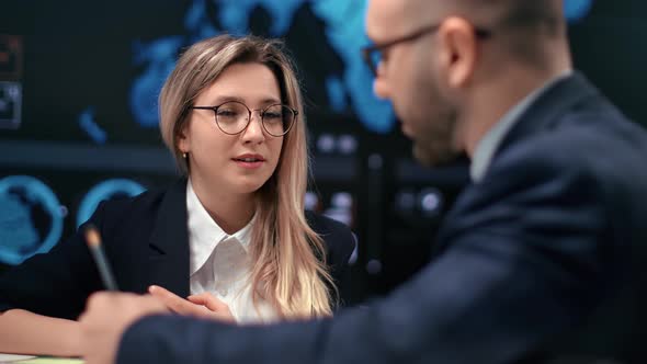 Stylish Female Boss Talking with Male Employee at Formal Meeting