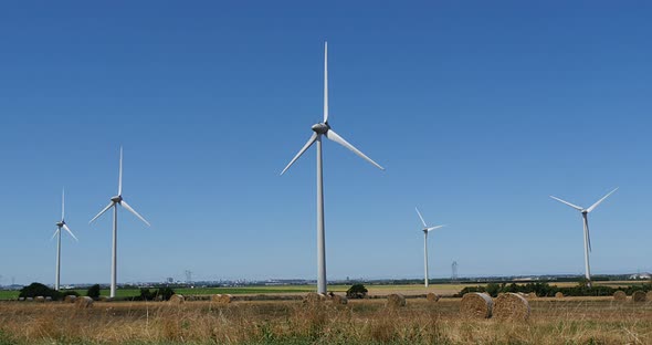 Wind Turbines with Blue Sky, near Caen in Normandy, Real Time 4K