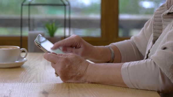 Hands of Woman Using Tablet