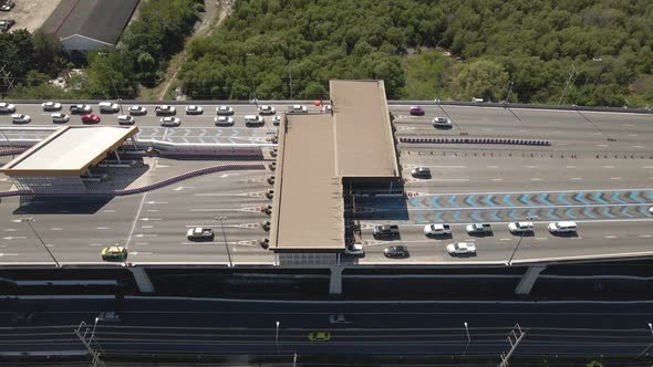 Pullback downward view of toll gateway in Thailand suspended Highway road