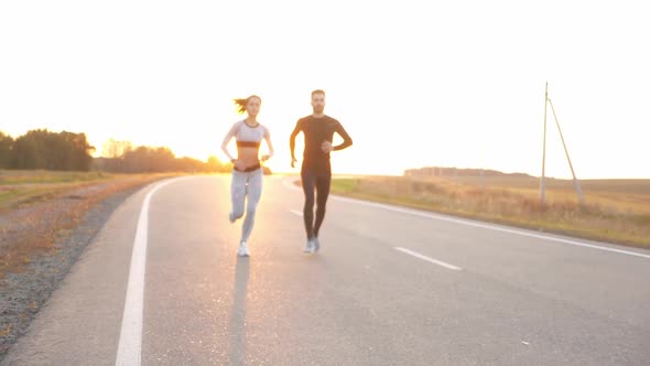 Healthy Lifestyle - Woman and Man Running.
