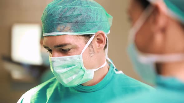 Surgeon team looking at a patient