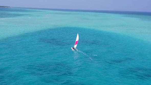 Aerial drone scenery of tourist beach by clear ocean and sand background