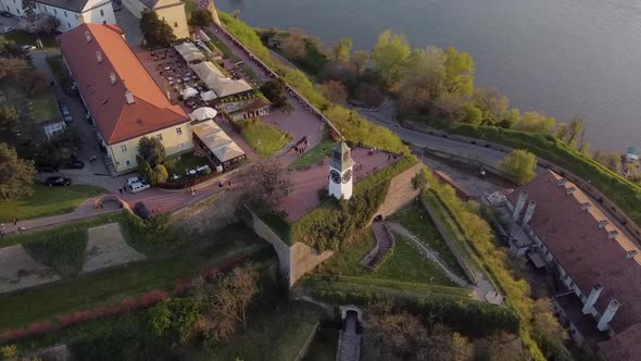 Aerial view of the Petrovaradin fortress in Novi Sad and Danube river, clock tower at sunset