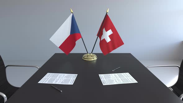 Flags of the Czech Republic and Switzerland and Papers