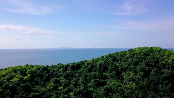 Aerial Shot Passing Over a Mountain Towards the Blue Sea Koh Ma Thailand