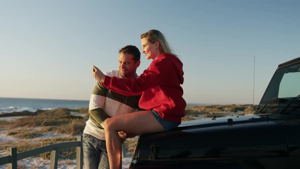 Couple in love enjoying free time on road trip together