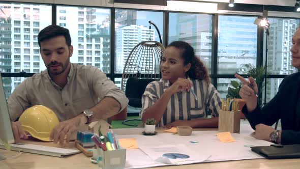 Creative Business People Group Having Conversation at Office Desk in Workplace