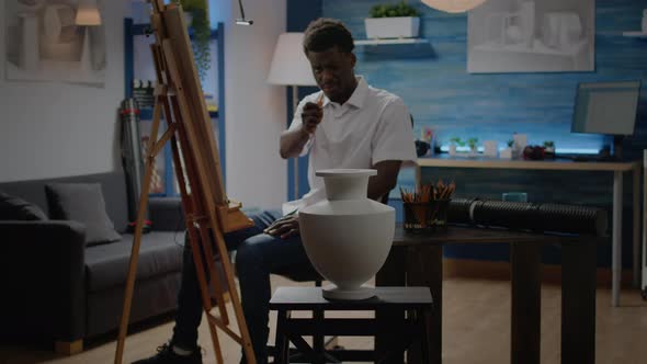 Artist of African American Ethnicity Analyzing Vase